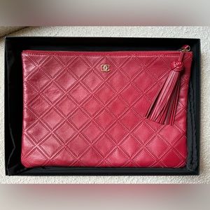 Authentic Large Quilted Chanel O-case with Tassel in Dark Red
